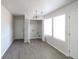 Bright laundry room with ample natural light, updated floors, and modern lighting fixture at 844 Glenshire Ct, Riverdale, GA 30274