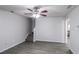 Open-concept living room with wood-look flooring, a ceiling fan, and stairs leading upstairs at 844 Glenshire Ct, Riverdale, GA 30274
