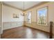 This dining room features hardwood floors, large windows, and classic trim at 961 Persimmon Pt, Atlanta, GA 30328