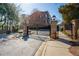 Gated entrance to Dunwoody Row featuring brick pillars and wrought iron gates at 961 Persimmon Pt, Atlanta, GA 30328