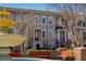 Charming townhome exterior featuring a water fountain, brick accents, and well-maintained landscaping at 961 Persimmon Pt, Atlanta, GA 30328