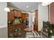 Kitchen with beautiful wooden cabinets, stainless steel appliances, and a granite-topped breakfast bar at 961 Persimmon Pt, Atlanta, GA 30328