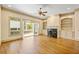 This living room has custom built-ins, a fireplace, and doors to a private balcony at 961 Persimmon Pt, Atlanta, GA 30328