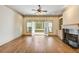 Living room with built-in bookshelves, fireplace and doors leading to balcony at 961 Persimmon Pt, Atlanta, GA 30328