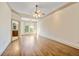 Main bedroom featuring hardwood floors, ceiling fan, and an ensuite bathroom at 961 Persimmon Pt, Atlanta, GA 30328