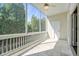 The beautiful screened porch features tile flooring and a ceiling fan, perfect for enjoying the outdoors at 961 Persimmon Pt, Atlanta, GA 30328