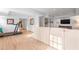 Basement room with a treadmill, comfortable couch, and mounted TV at 345 W Spalding Dr, Sandy Springs, GA 30328