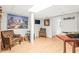 Basement room featuring wood floors, a large painting, comfortable seating, and a television at 345 W Spalding Dr, Sandy Springs, GA 30328