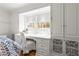 Bedroom featuring a built in desk with natural light and ample storage at 345 W Spalding Dr, Sandy Springs, GA 30328