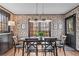Charming dining room with floral wallpaper, black trim, and a black dining set at 345 W Spalding Dr, Sandy Springs, GA 30328