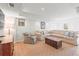 A spacious living room with a sectional couch, accent chair, and entertainment center offers a cozy spot at 345 W Spalding Dr, Sandy Springs, GA 30328