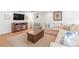 Spacious living room with white wainscoting and a large sectional couch for comfortable Gathering living at 345 W Spalding Dr, Sandy Springs, GA 30328