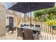 Outdoor patio features wooden decking and outdoor table and chairs with a shade umbrella at 345 W Spalding Dr, Sandy Springs, GA 30328