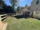 Expansive backyard featuring a large porch with stairs and a new wooden fence at 3559 Sawmill Ter, Marietta, GA 30062