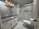 Beautifully renovated bathroom with a modern vanity and stylish shower with marble-like tile at 3559 Sawmill Ter, Marietta, GA 30062