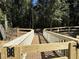 Wooden bridge and fence overlooking green foliage at 3559 Sawmill Ter, Marietta, GA 30062