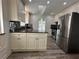 Bright kitchen with stainless steel appliances, granite countertops and an island at 3559 Sawmill Ter, Marietta, GA 30062