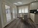 Kitchen area with French doors leading to deck and breakfast nook with modern seating at 3559 Sawmill Ter, Marietta, GA 30062