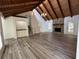 Bright living area with wooden ceilings and flooring, complemented by a stone fireplace and wet bar at 3559 Sawmill Ter, Marietta, GA 30062
