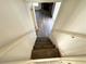 A neutral painted staircase leading to the lower level at 3559 Sawmill Ter, Marietta, GA 30062