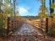 Exterior view of a wooden walking bridge covered in Fall leaves, a tranquil spot to enjoy the scenery at 3559 Sawmill Ter, Marietta, GA 30062