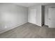 Bedroom featuring neutral walls, carpet, and two closets; simple, ready for personalization at 4963 Arbor View Nw Pkwy, Acworth, GA 30101