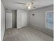 Bedroom featuring neutral walls, carpet, and a ceiling fan; window offers natural light at 4963 Arbor View Nw Pkwy, Acworth, GA 30101