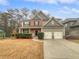 Charming two-story home with a two car garage, covered entry, and well manicured landscaping at 4963 Arbor View Nw Pkwy, Acworth, GA 30101