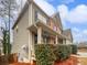 Charming two-story home with a covered porch, vinyl siding and manicured landscaping at 4963 Arbor View Nw Pkwy, Acworth, GA 30101