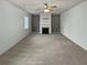 Bright living room with fireplace, ceiling fan, and neutral paint at 4963 Arbor View Nw Pkwy, Acworth, GA 30101