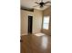 Bedroom with laminate flooring, natural light, a ceiling fan, and neutral paint at 740 Kibbe Cir, Lawrenceville, GA 30044