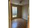 Cozy bedroom with laminate flooring, a ceiling fan, and a bright window at 740 Kibbe Cir, Lawrenceville, GA 30044