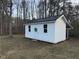 Newly built shed with black metal roof and white painted walls is perfect for extra storage at 762 Thompson Ln, Loganville, GA 30052