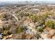 Aerial view of the neighborhood showing street, trees and downtown skyline in the distance at 1055 Ormewood Se Ave, Atlanta, GA 30316