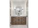 Bathroom vanity with shaker cabinets, stone countertop and modern fixtures at 1055 Ormewood Se Ave, Atlanta, GA 30316
