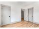 Minimalist bedroom with hardwood floors and bright walls, providing a versatile space at 1055 Ormewood Se Ave, Atlanta, GA 30316