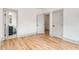 Bedroom with hardwood floors and bright walls, featuring doorways to another room and closet at 1055 Ormewood Se Ave, Atlanta, GA 30316