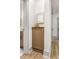Hallway nook featuring a small cabinet for storage and modern wall art at 1055 Ormewood Se Ave, Atlanta, GA 30316