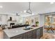 Open-concept kitchen with modern appliances and finishes, flowing into the living room and dining area at 1055 Ormewood Se Ave, Atlanta, GA 30316