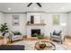 Bright living room featuring fireplace, hardwood floors, and stylish decor at 1055 Ormewood Se Ave, Atlanta, GA 30316