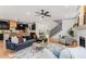 Open concept living space with kitchen, stairs, and fireplace at 1055 Ormewood Se Ave, Atlanta, GA 30316