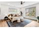 Sun-filled main bedroom with neutral decor, hardwood floors, and bright windows at 1055 Ormewood Se Ave, Atlanta, GA 30316