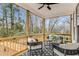 Inviting screened porch with comfortable seating and scenic views of the wooded backyard at 1055 Ormewood Se Ave, Atlanta, GA 30316