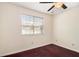 Bedroom featuring a ceiling fan and a window with blinds at 1947 Phillips Lake Blf, Lithonia, GA 30058