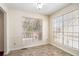 Bright breakfast nook with chair rail trim, tile floors, and large windows offering lots of natural light at 1947 Phillips Lake Blf, Lithonia, GA 30058