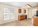 Eat-in kitchen featuring tile flooring, wood cabinetry, granite countertops, and stainless steel appliances at 1947 Phillips Lake Blf, Lithonia, GA 30058