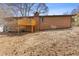 A backyard view showcasing the deck area of the home on a sunny day at 5277 Cardinal Nw Ln, Lilburn, GA 30047