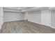 Large basement area features neutral paint, new flooring and easy access doors at 5277 Cardinal Nw Ln, Lilburn, GA 30047