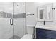 Modern bathroom featuring a glass shower, mosaic accents, and sleek fixtures at 5277 Cardinal Nw Ln, Lilburn, GA 30047
