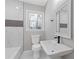 Modern bathroom with tiled walls, mosaic accents, and sleek fixtures at 5277 Cardinal Nw Ln, Lilburn, GA 30047